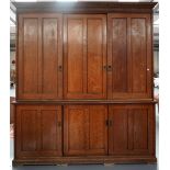 A LARGE OAK 'HOUSE KEEPERS CUPBOARD', EARLY 20TH CENTURY, with dentil cornice over three sliding