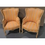 A PAIR OF LOUIS XVI STYLE FAUTEUILS with painted frames and yellow broad-striped upholstery. 96 x 53