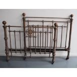 A VICTORIAN MAPLE & CO. ORNATE BRASS DOUBLE BED, the foot with central sunflower motif.  142 X 119