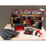 BOXED SCALEXTRIC LE MANS PLAYSET and two boxes of Scalextric track, models and accessories.