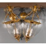 A PAIR OF CONTEMPORARY BRASS MOUNTED HUNDI CENTRAL HANGING LANTERNS WITH GLASS BELL SHADES  67cm