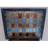 LEADED LIGHT PANE MADE UP OF 45 GLASS PANELS, some depicting wildlife and distressed gilt picture