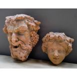 CONTEMPORARY TERRACOTTA WALL FOUNT DEPICTING SATYR and a smaller cherub decorated wall fount  28cm x