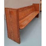 A PITCHED PINE PEW OF PLAIN FORM, circa 1900.  93 x 200 x 43 cms
