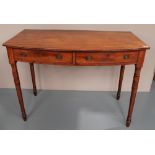 A 19TH CENTURY BOW FRONT SIDE TABLE WITH TWO FREIZE DRAWERS, upon slim ring-turned legs. 72 x 99 x