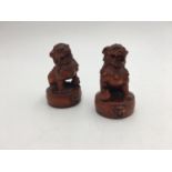 PAIR OF CHINESE CARVED WOOD BUDDHIST LIONS 20TH CENTURY 7cm high