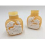 PAIR OF CARVED SOAPSTONE SNUFF BOTTLES 20TH CENTURY carved in high relief with figures in a mountain