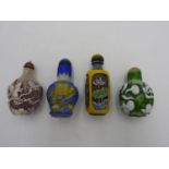 FOUR CHINESE GLASS OVERLAY SNUFF BOTTLES 20TH CENTURY largest 8.5cm high, smallest, 6.5cm high