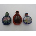 THREE CHINESE PEKING GLASS REVERSE PAINTED SNUFF BOTTLES 20TH CENTURY 7cm high approx.