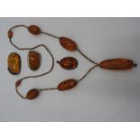 SILVER ART NOUVEAU AMBER SET BROOCH, AMBER PENDANT, AMBER BEAD NECKLACE AND ONE OTHER AMBER SET