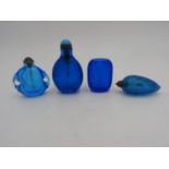 FOUR CHINESE BLUE-GLASS SNUFF BOTTLES 20TH CENTURY one lacks stopper largest, 8.5cm high, smallest ,