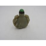 CHINESE CARVED CELADON JADE SNUFF BOTTLE 20TH CENTURY carved in high relief with two qilins  6.5cm