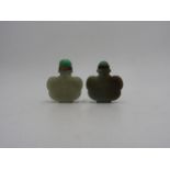 TWO CHINESE CARVED CELADON JADE SNUFF BOTTLES 20TH CENTURY of cloud form 5cm & 5.5cm high