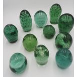 GROUP OF ELEVEN VICTORIAN DUMP GLASS PAPERWEIGHTS LATE 19TH CENTURY largest, 14cm high, smallest,