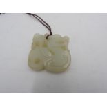 CHINESE WHITE JADE 'DRAGON' PENDANT LATE QING / REPUBLIC PERIOD 4cm wide