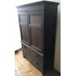 A 19th CENTURY TWO DOOR PANELLED CUPBOARD ON A CHEST OF TWO LONG DRAWERS