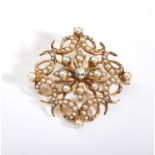 A late Victorian 15ct gold pearl and diamond brooch / pendant, the openwork scrolling panel