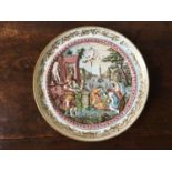 CAPODIMONTE EMBOSSED DECORATIVE WALL PLATE DEPICTING BACCHANALIAN SCENE, with gilded swag