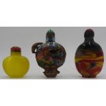 TWO CHINESE GLASS SNUFF BOTTLES 20TH CENTURY together with a CHINESE GILT-METAL MOUNTED PAINTED