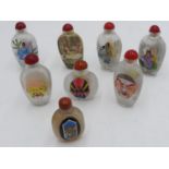 SEVEN CHINESE REVERSE PAINTED GLASS SNUFF BOTTLES 20TH CENTURY together with an AGATE SNUFF