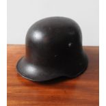 FIRST WORLD WAR GERMAN STEEL HELMET, complete with lugs for Stirnpanzer