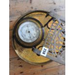 BRASS SHIP'S BAROMETER BY JOHN BARKER AND CO. KENSINGTON, with an ornate brass tray and a brass