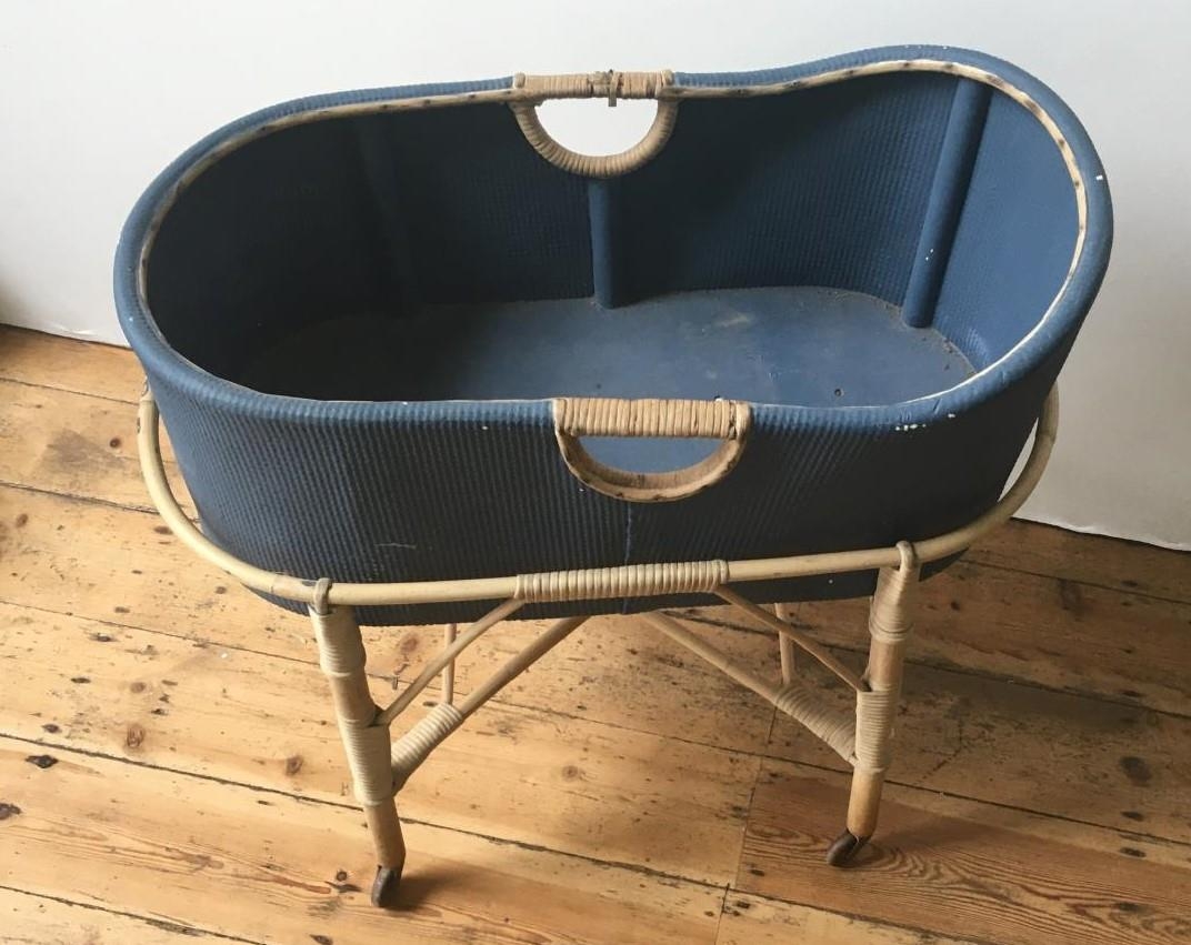 VINTAGE BLUE PAINTED LOOM COT ON RATTAN STAND, with 4 casters 78 x 43 x 83cms