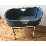 VINTAGE BLUE PAINTED LOOM COT ON RATTAN STAND, with 4 casters 78 x 43 x 83cms