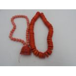 TWO CHINESE CORAL BEAD NECKLACES AND A BUDDHA HEAD PENDANT 20TH CENTURY (3)