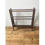 LATE VICTORIAN MAHOGANY TAPERED TOWEL RAIL, with turned spindle supports and finials 85cm high x