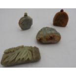 FOUR CHINESE CARVED HARDSTONE SNUFF BOTTLES 20TH CENTURY one lacking a stopper largest, 8.5cm