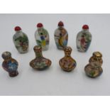 BOXED SET OF FOUR CHINESE REVERSE PAINTED SNUFF BOTTLES 20TH CENTURY painted with elegant ladies,