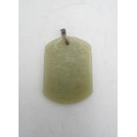 CHINESE CARVED WHITE JADE PENDANT  QING DYNASTY with a silver mount 6cm high, 4.5cm wide