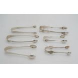 FOUR PAIRS OF ENGLISH SILVER SUGAR TONGS VARIOUS MAKERS AND DATES 5.1 troy ozs. 159 grams