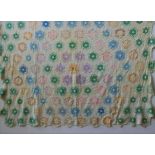 AN AMERICAN VINTAGE NEEDLEWORK BED SPREAD 'GRANDMOTHER'S FLOWER GARDEN' PATTERN, originating from