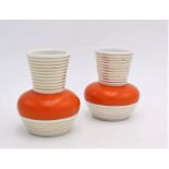 A PAIR OF ITALIAN ART DECO STYLE BOLSTER VASES, orange and cream glaze with gilded ribbed