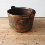 A VINTAGE POLISHED COPPER RIVETED BUCKET WITH IRON RING HANDLE, 48cm dia, 32cm deep