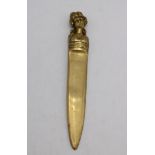 A BRASS LETTER OPENER, THE HANDLE DECORATED WITH BUST OF VINTAGE LADY, 21cm long