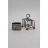 A HALLMARK SILVER SMALL TOAST RACK AND NAPKIN RING, the ring London 1977, 2.5 oz in total