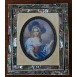 A 19TH CENTURY PAINTED PORTRAIT OF LADY ON BONE PANEL WITH AN ORNATE MOTHER OF PEARL FRAME, 14.5 x