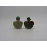 TWO CHINESE CARVED CELADON JADE SNUFF BOTTLES 20TH CENTURY of cloud form 5cm & 5.5cm high Property