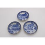 A SET OF THREE WILLOW PATTERN BLUE AND WHITE DISHES, depicting oriental rural scene with gilded edge