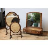 A VICTORIAN MAHOGANY BOW-FRONT SWING MIRROR WITH THREE TRINKET DRAWERS, and two other table mirrors,