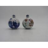 CHINESE DOUCAI GLOBULAR SNUFF BOTTLE 20TH CENTURY together with a SIMILAR BLUE AND WHITE EXAMPLE (2)
