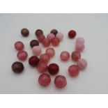 GROUP OF TWENTY SEVEN CHINESE GLASS BEADS 20TH CENTURY in shades of pink and purple  (27)