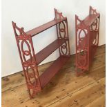 PAIR OF RED PAINTED HANGING WALL SHELVES 20TH CENTURY with fret pierced sides 67cm high, 69.5cm wide