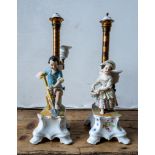 A PAIR OF FRENCH 19TH CENTURY BISQUE ADJUSTABLE CANDLESTICKS, decorated with figures of children