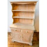 A LIME WASH EFFECT MODERN PINE KITCHEN DRESSER with two panelled doors and two drawers, 167 x 92 x