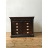 AN AMBERG LATE VICTORIAN OAK PATENT CABINET LETTER FILE, The rectangular moulded top above a