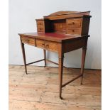 A VICTORIAN MAHOGANY CROSS BANDED LADIES WRITING TABLE, on tapered legs supported by stretcher bars,